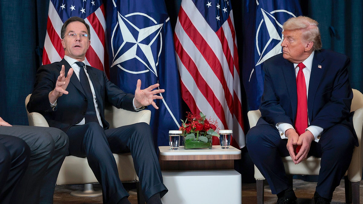 U.S. President Donald Trump listening to NATO Secretary General Mark Rutte during a meeting in Davos Switzerland