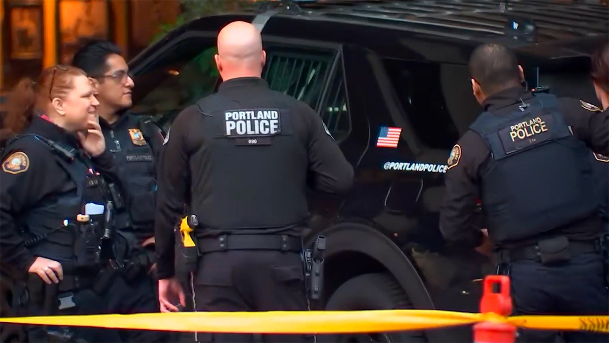 Police investigate the crash at an exclusive social club in Portland, Oregon.