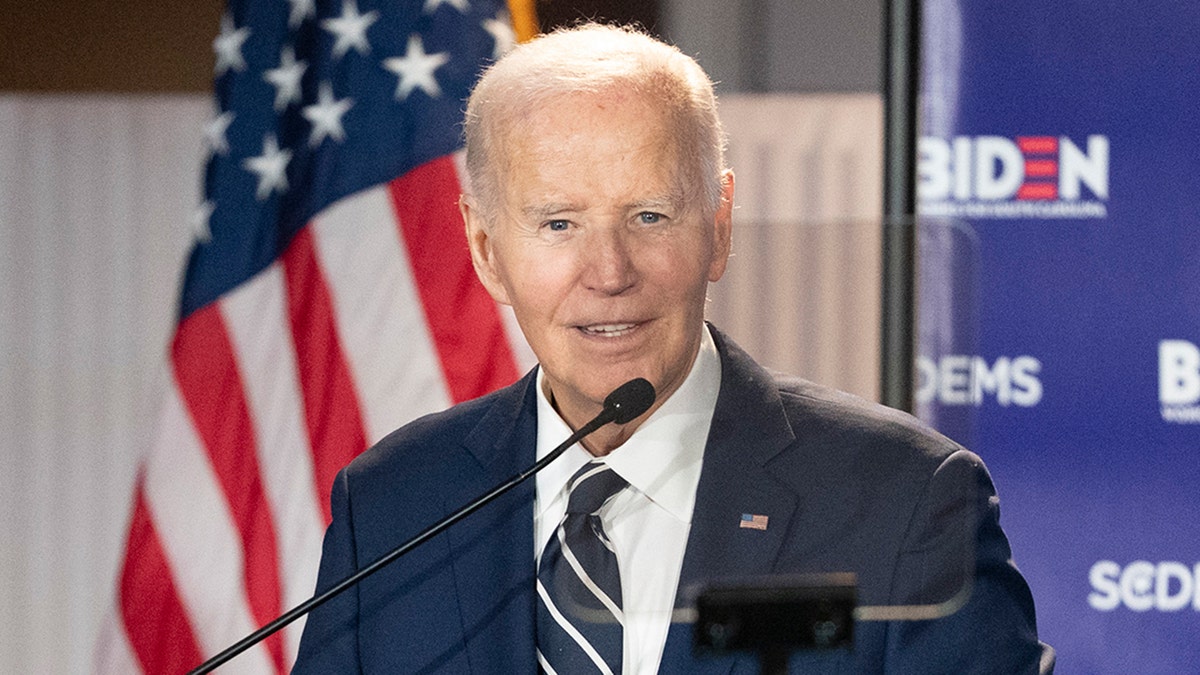 Former President Joe Biden speaking to a crowd at a fundraising event