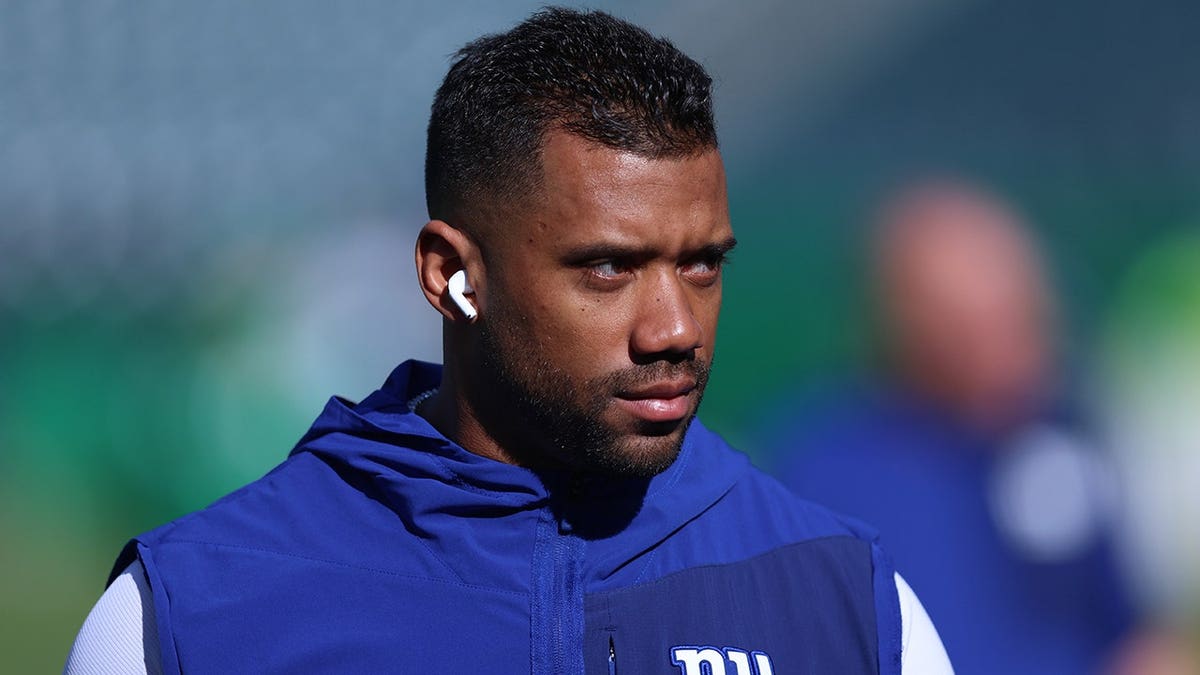 New York Giants quarterback Russell Wilson standing on the field at Lincoln Financial Field