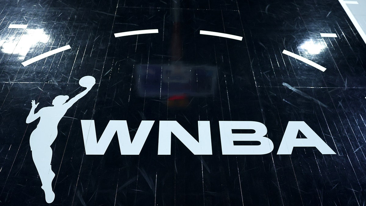WNBA logo displayed on basketball court at Michelob ULTRA Arena