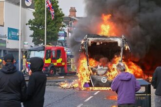 Vehicles set ablaze as protests erupt in Belfast following stabbing