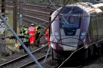 Driver dies and 33 seriously injured after two trains collide in UK