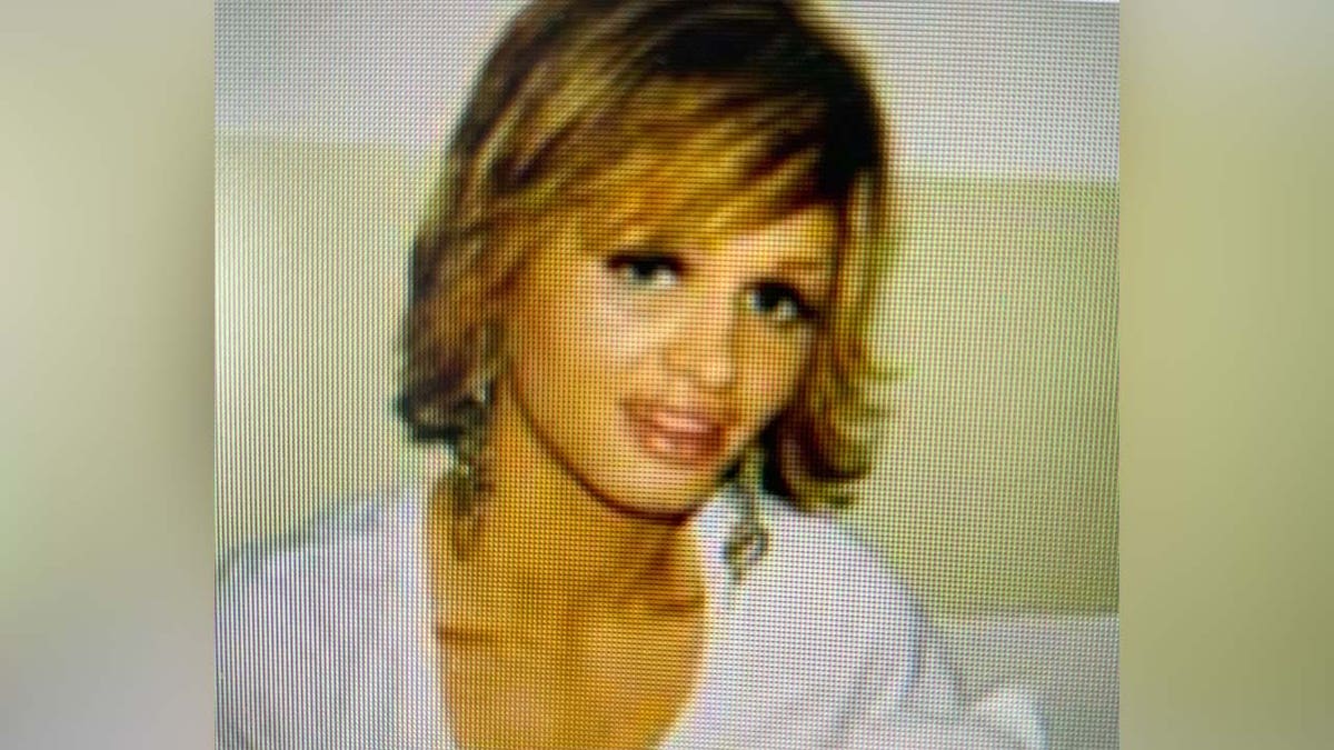Shannan Gilbert smiles in an undated family photo, she has bleached blonde hair and a white shirt