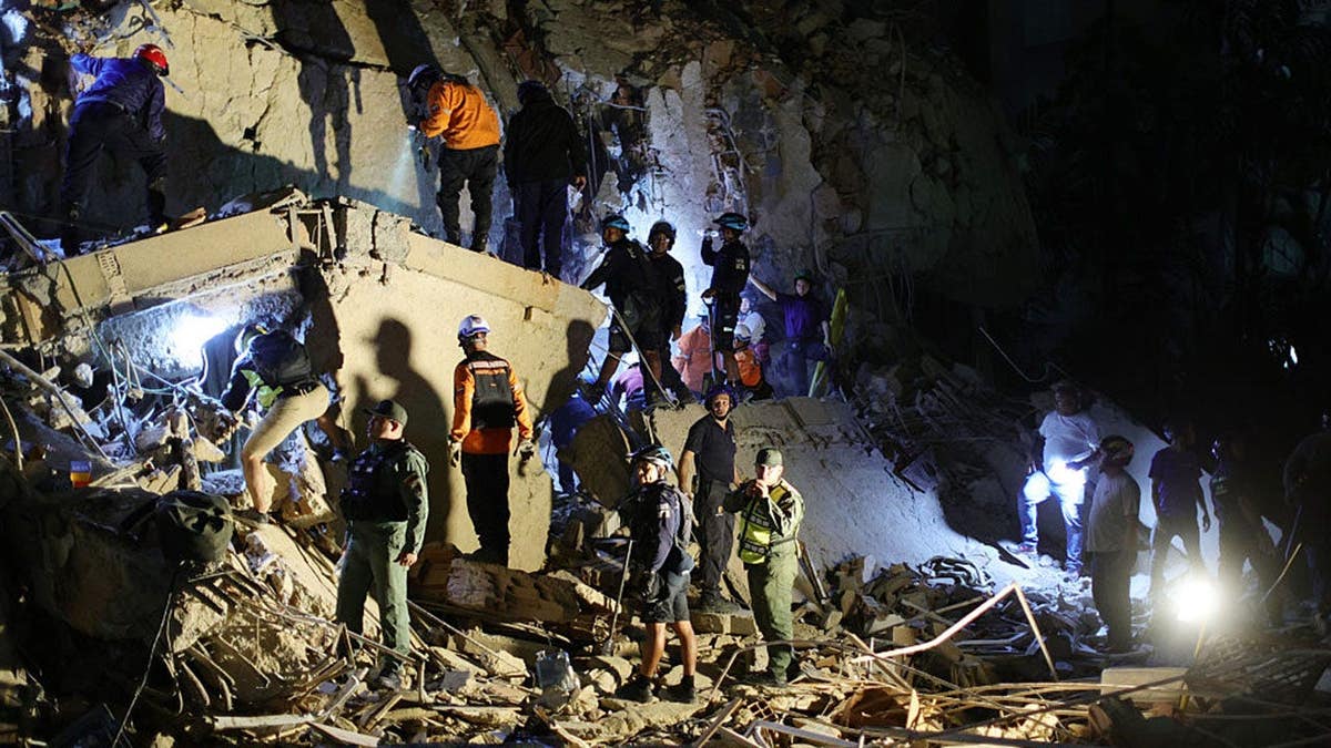First responders attending a damaged building in Caracas after an earthquake.