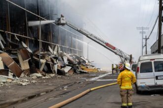 Race against time in fight against 500,000sqf LA inferno amid fears of biohazard fallout
