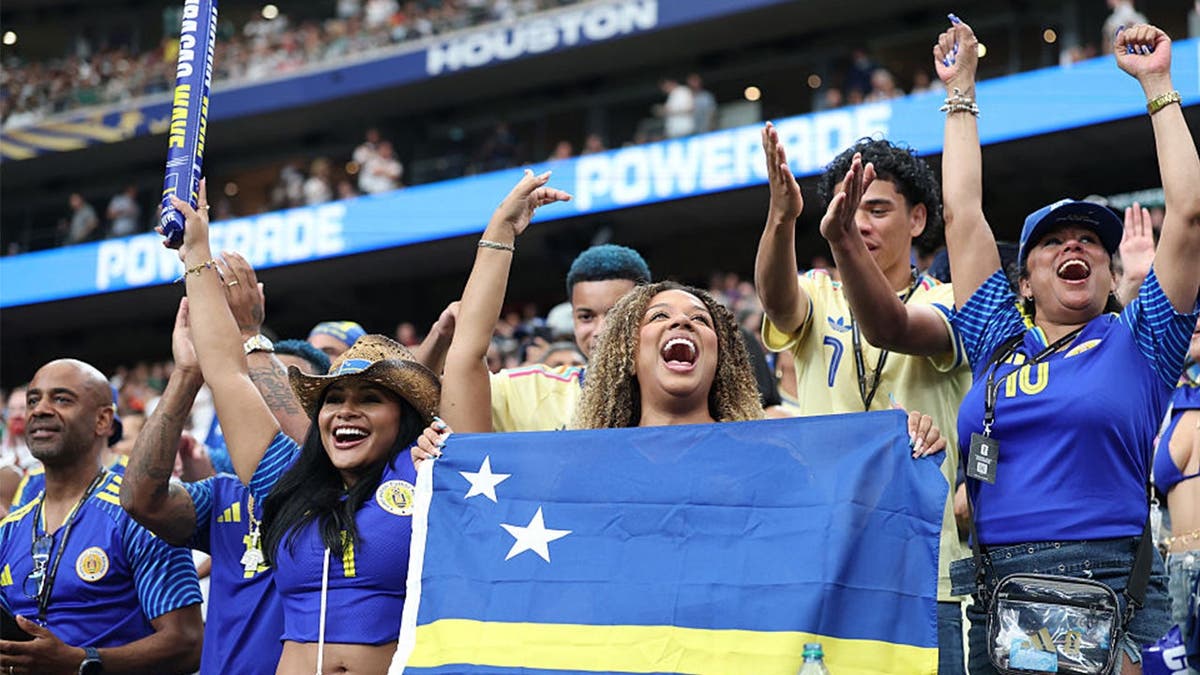 Curacao fans cheer in the stands during the FIFA World Cup 2026