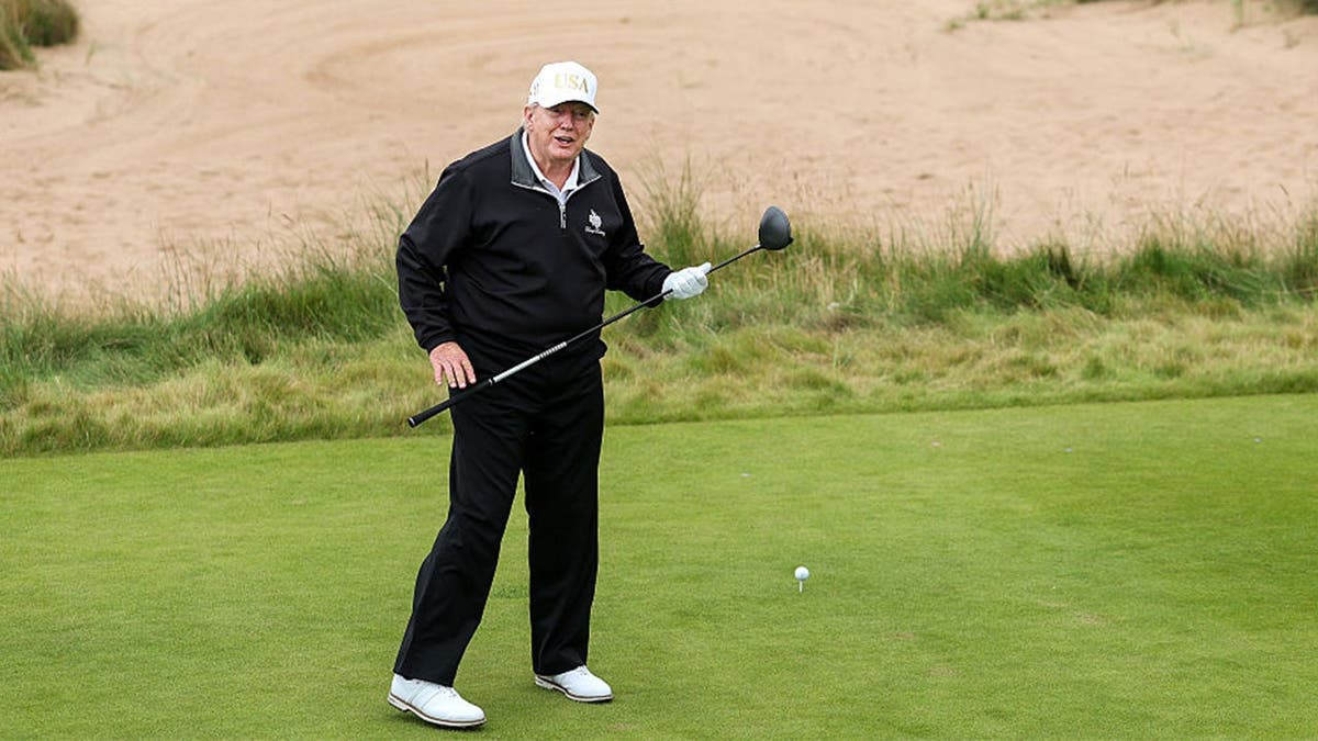 U.S. President Donald Trump tees off