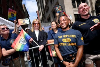 NYPD commish stands with armed gay cops on sidelines of NYC Pride March after slamming organizers for barring them