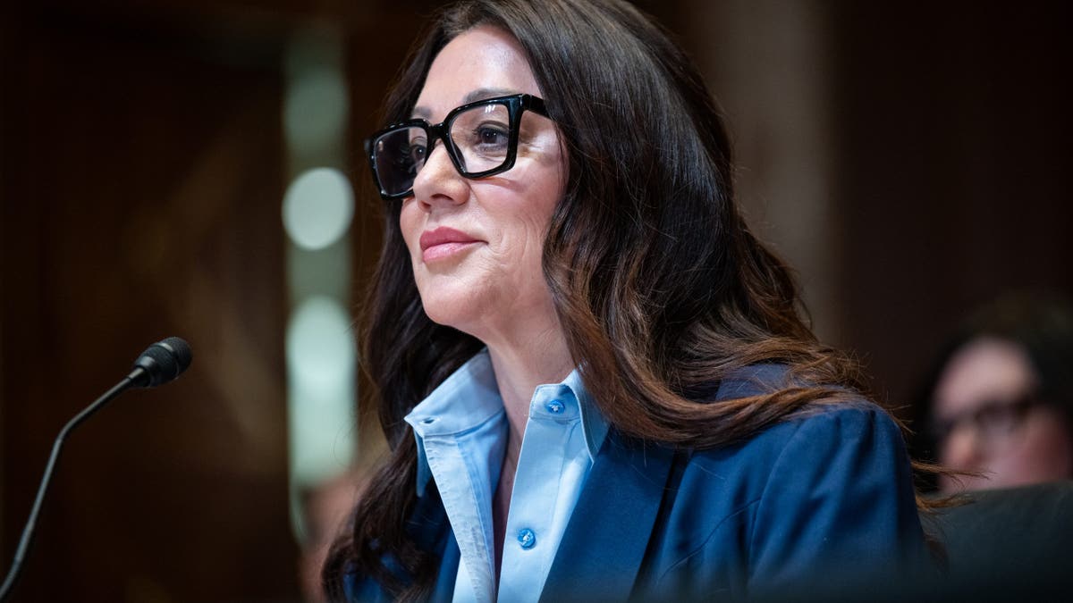 Lori Chavez-DeRemer wearing black glasses.