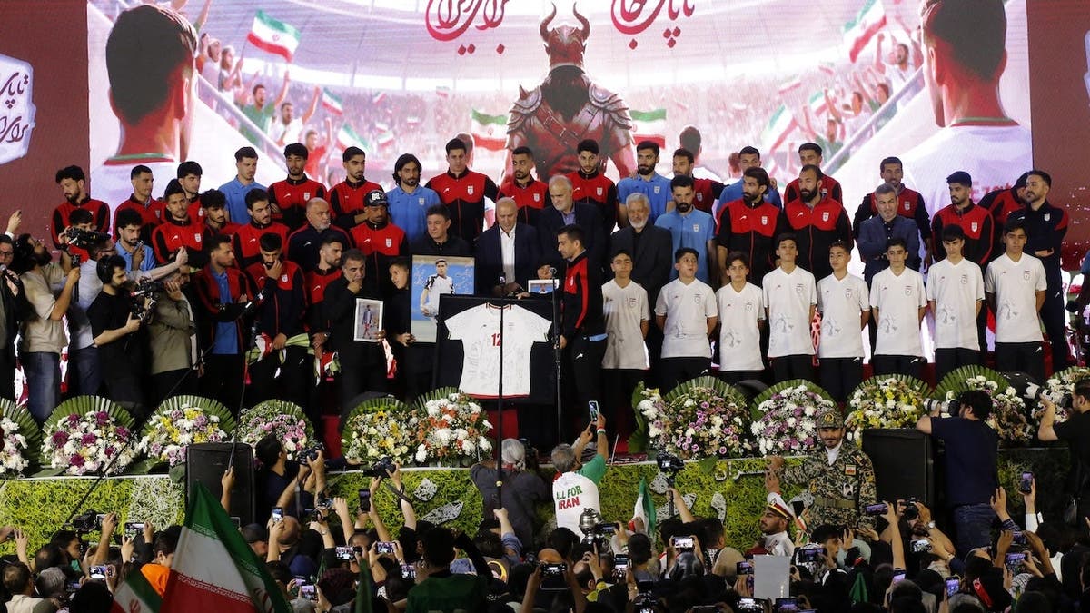 Iranian football supporters gather at Enghelab Square in Tehran during a ceremony for the national team