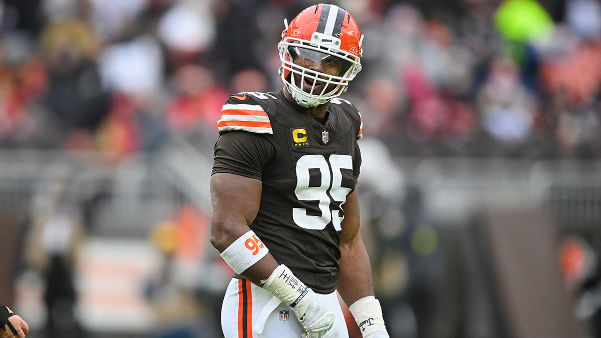 Myles Garrett standing on the field during an NFL game in Cleveland