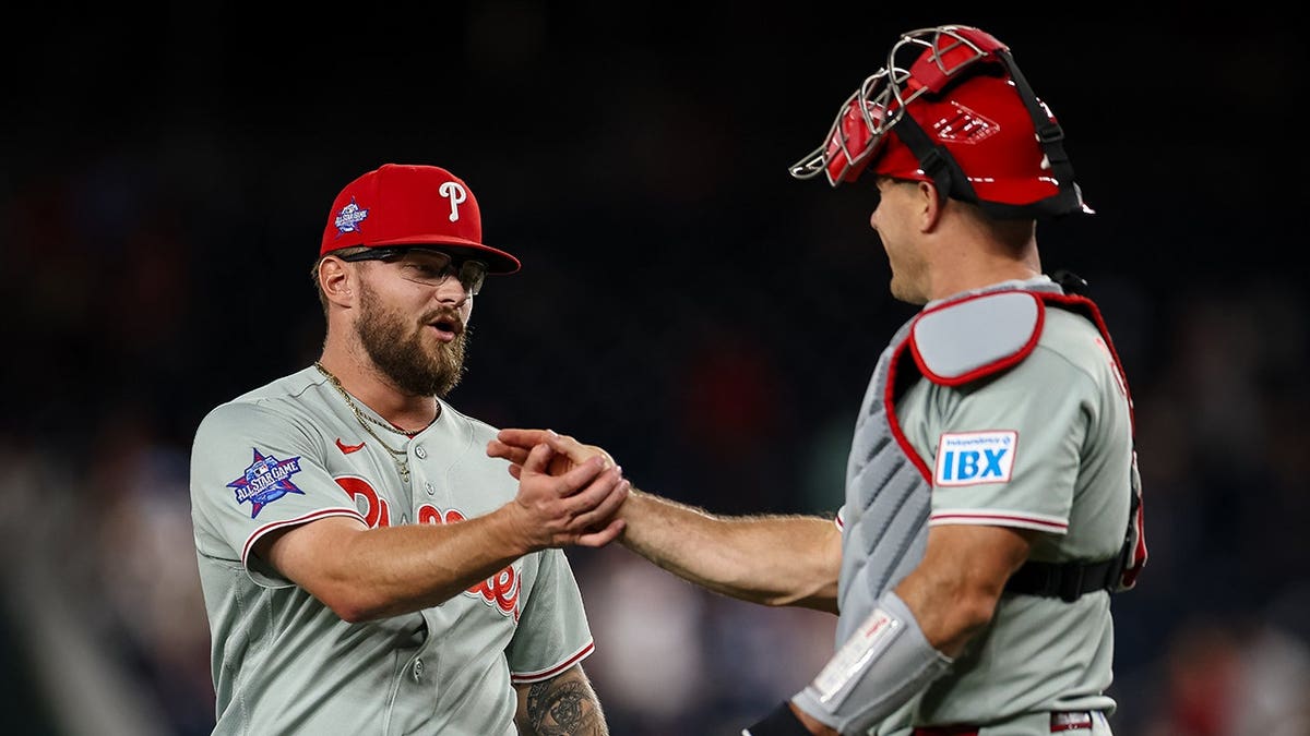 Chase Shugart and J.T. Realmuto celebrating at Nationals Park in Washington, D.C.