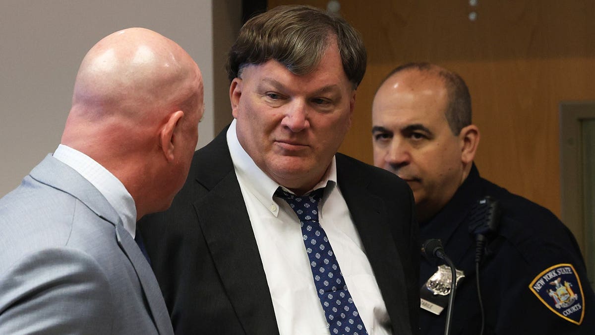 Rex A. Heuermann standing in Suffolk County Court during guilty plea hearing