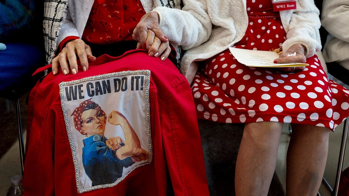 Rosies Sylvia Tania and Delphine Klaus holding hands at U.S. Capitol ceremony
