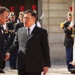 Viral fake AI-image shows Macron kneeling before Thai king