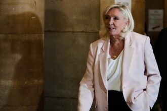 Paris court clears way for Le Pen presidential bid but with ankle tag
