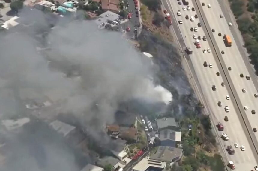 Fast-moving LA wildfire torches home, threatens nearby properties