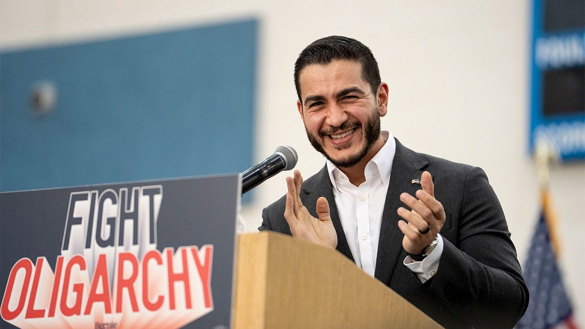 El-Sayed clapping during speech to fight oligarchy.