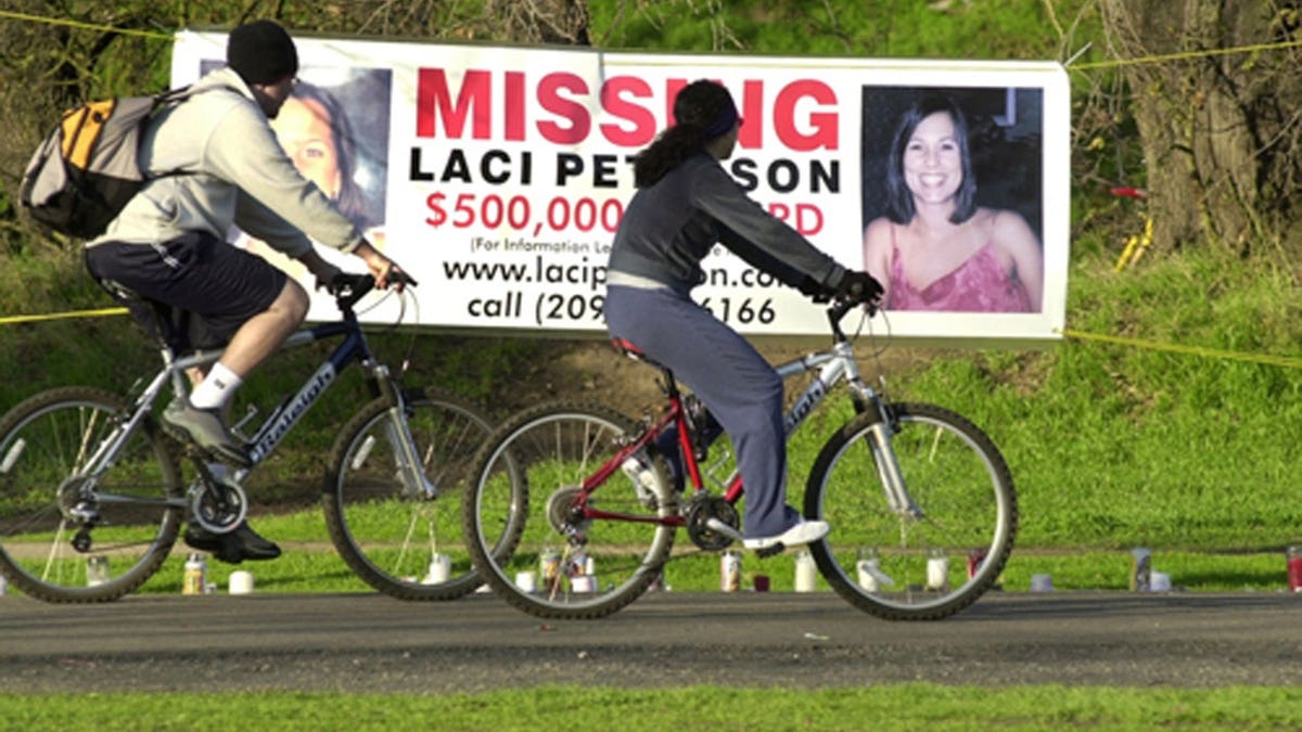 Bikers ride past a sign in Modesto, California.