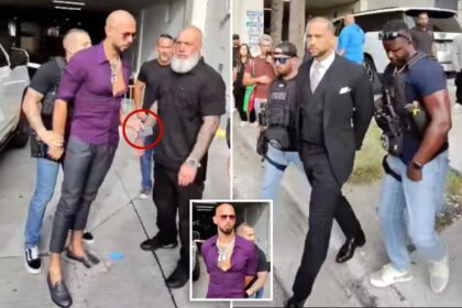Andrew Tate arrest video shows moment he tried to give phone to bodyguard as he’s cuffed by US Marshals