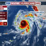 Major Hurricane Genevieve roars in the Pacific as Fausto weakens to a tropical storm near Hawaii