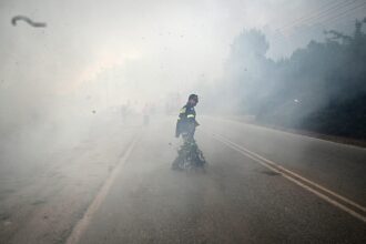 ‘Wall of fire’ forces sea evacuation as European wildfires continue