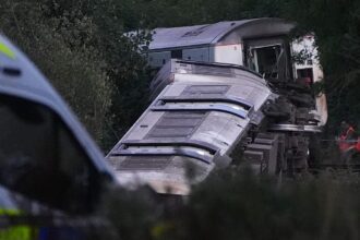Two seriously injured as train derails in south England, police say