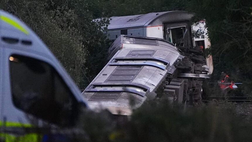 Two seriously injured as train derails in south England, police say