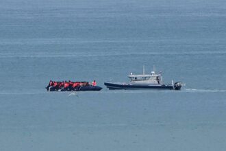 Record 230 migrants cross English Channel in single small boat