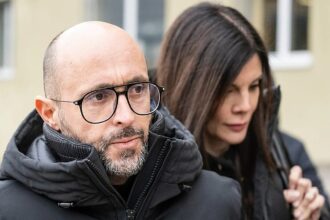 Owner of Swiss bar in deadly blaze held for domestic abuse, media say