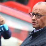 Merz visits Hürtgen Forest fire site, met with boos and whistles
