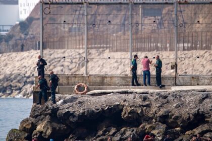 Spain mobilises troops as thousands swim across border from Morocco