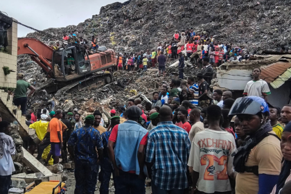 Massive garbage heap collapses onto homes, killing at least 30 as rescuers search for survivors