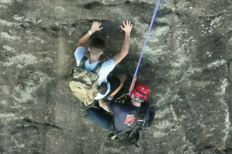 Free climber stranded on Georgia rock face calls 911, prompting dramatic rescue by firefighter