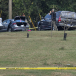 Police fatally shoot sword-wielding man after woman found trapped in car, officials say