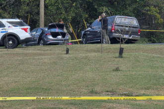 Police fatally shoot sword-wielding man after woman found trapped in car, officials say