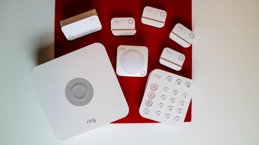 Ring's white security hub and sensors from above.