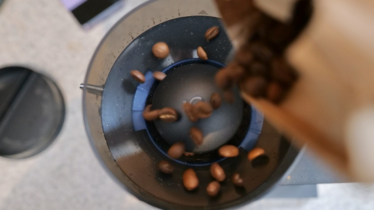 Pouring beans into the Opus' hopper