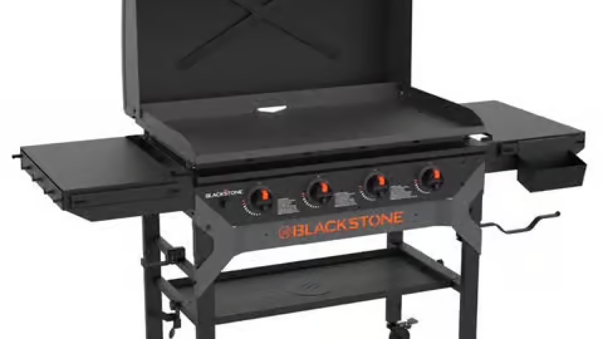 A flat-top grill ready to use with it's lid open.