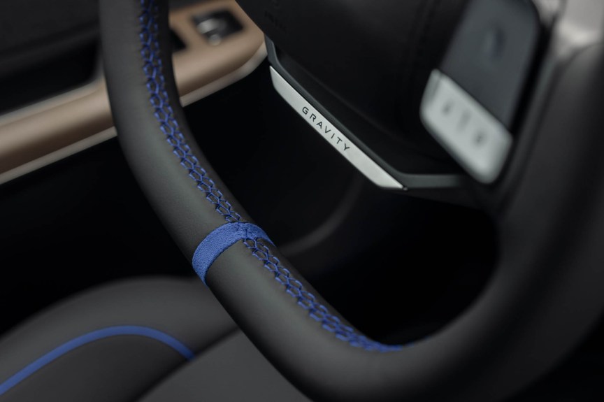 Lucid Gravity interior detail showcasing black leather and blue contrast stitching