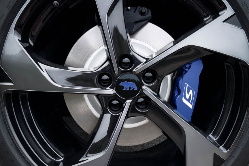 Close up of GT-S sport wheel with blue Lucid Bear logo and brake caliper.