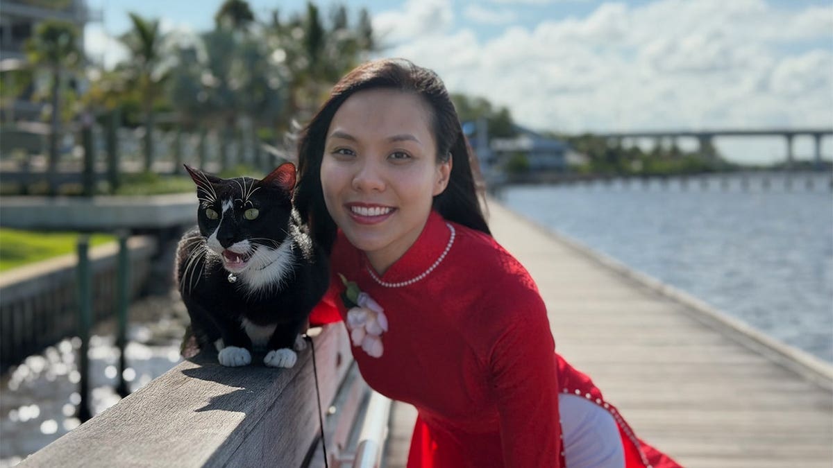Florida woman Linh Nguyen with rescued pet Patchy