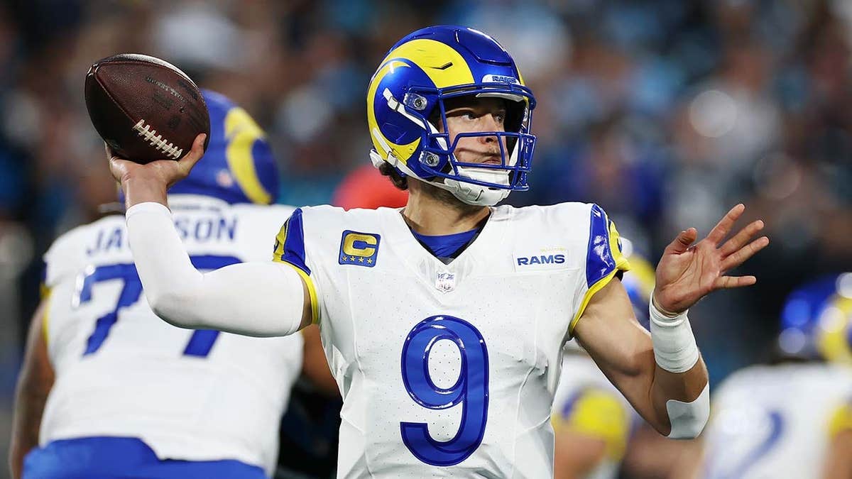 Matthew Stafford throwing a pass during an NFL playoff game