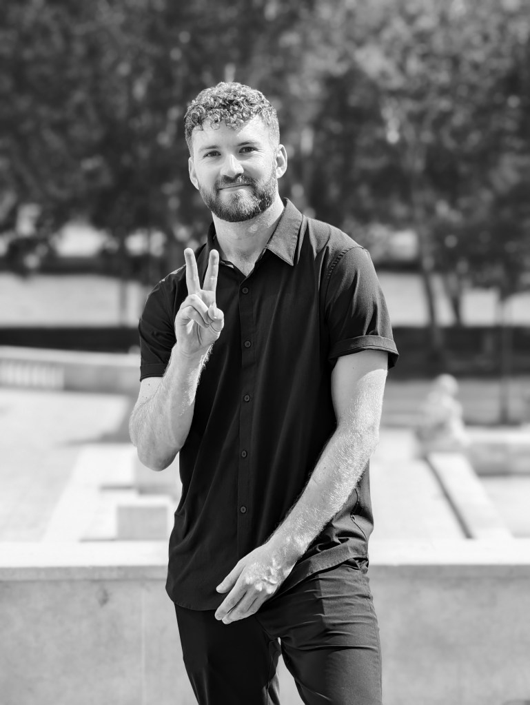Image of a man giving the peace sign