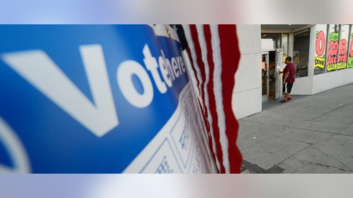 LOS ANGELES, CA - NOVEMBER 06: A voter walks into the polling place at Robertson Honda car dealership to cast his ballot in the US presidential elections on November 6, 2012 in Los Angeles, California. Californians will cast ballots in dozens of tight races including Gov. Jerry Brown's tax plan, abolishing the death penalty, easing the state's strict 'three strikes' sentencing law and also in the Presidential race between Democratic President Barack Obama and Republican candidate Mitt Romney. (Photo by Kevork Djansezian/Getty Images)