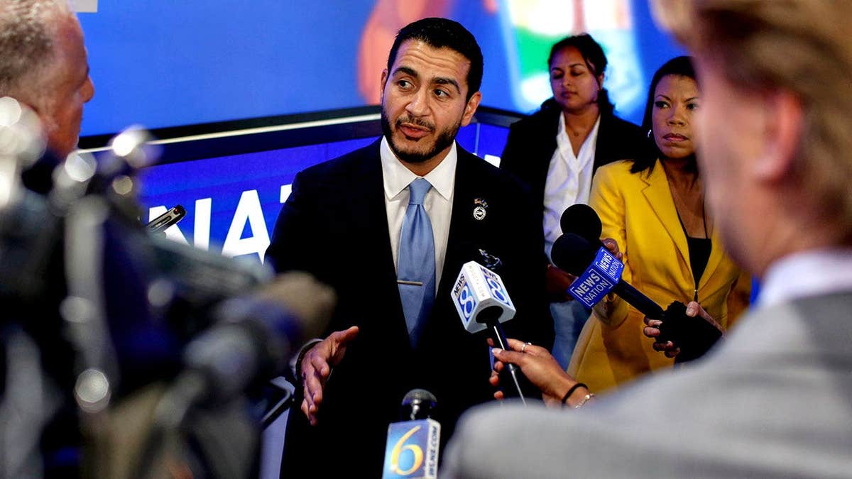 Sen candidate Abdul El-Sayed gestures while speaking with reporters