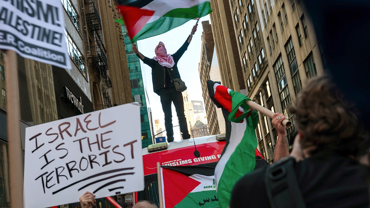 Supporters of Palestine participate in a rally in Times Square to condemn the recent fighting in Gaza on Oct. 13, 2023, in New York City.