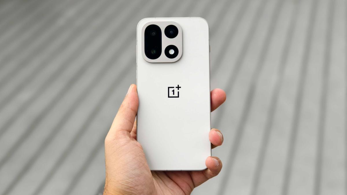 Prakhar Khanna holding the OnePlus 15.