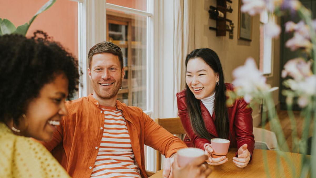 Three people having coffee and talking